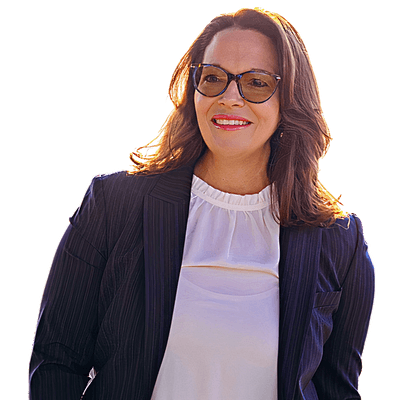 A woman in a navy-blue blazer and white blouse